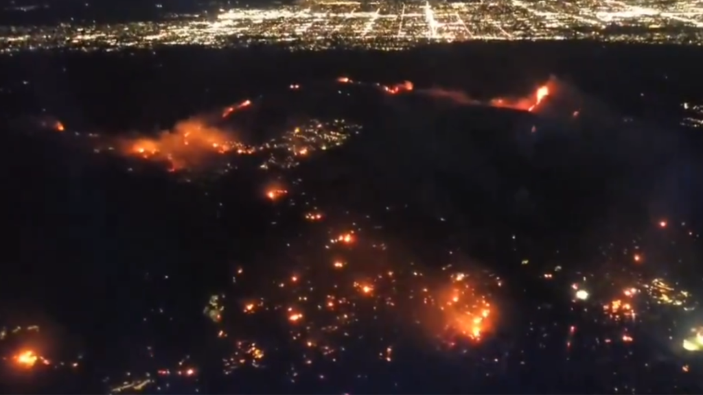 fire explodes in the Hollywood Hills